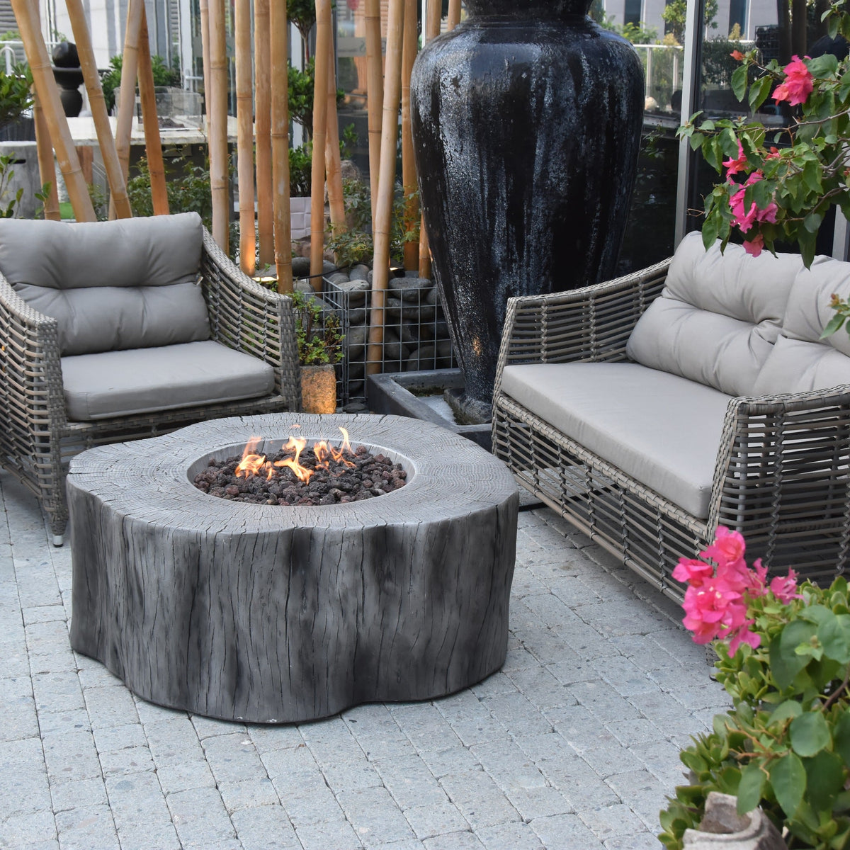 Elementi Manchester Fire Table - Classic Gray - Garden Terrace Living Scene with Outdoor Sofa