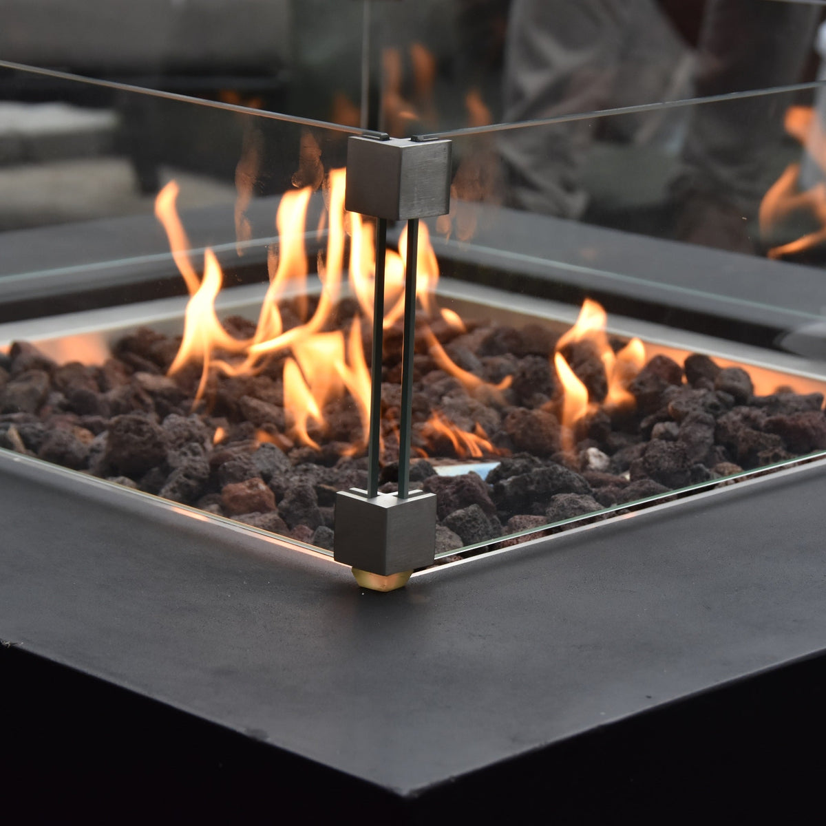 Modeno Aurora Fire Table - Roaring Flames Enclosed in Glass Windscreen Close-Up