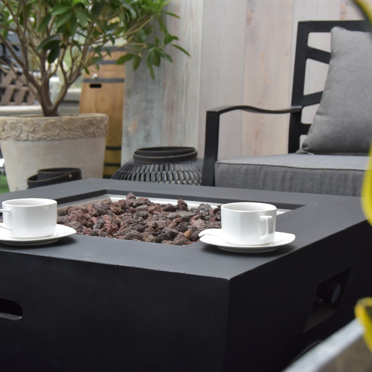 Modeno Aurora Fire Table - Outdoor Lounge Scene with Coffee Cups on Smooth Fire Table Ledge