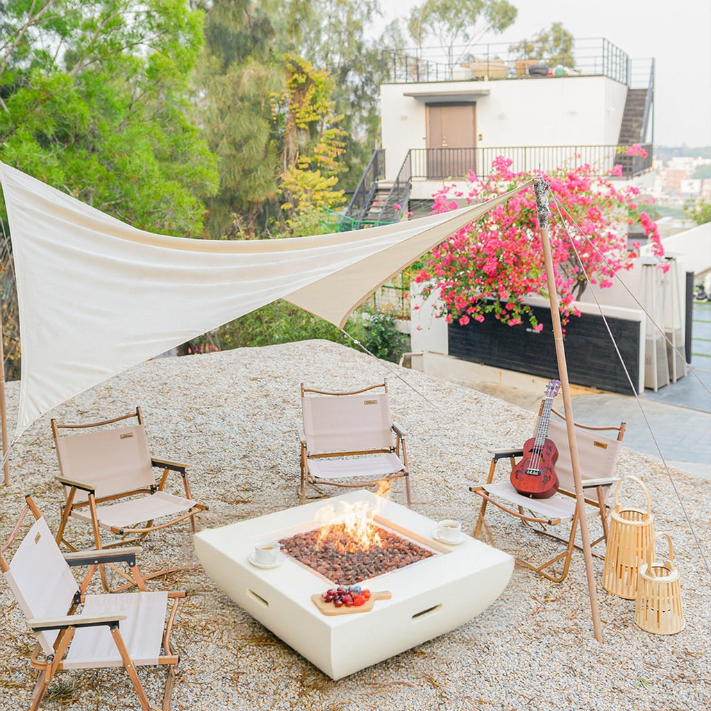 Modeno Florence Fire Table Cream White - Overhead Perspective on Gravel Courtyard with Fire Pit Lit