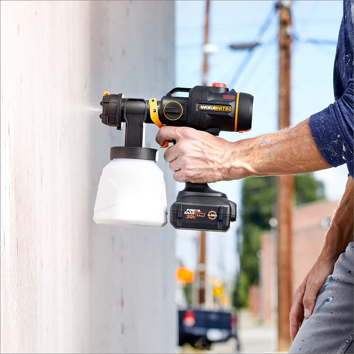 Painting an exterior wall with the Worx Nitro cordless paint sprayer